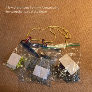 Camping equipment in bags, with holes and carabiners, on a connected loop